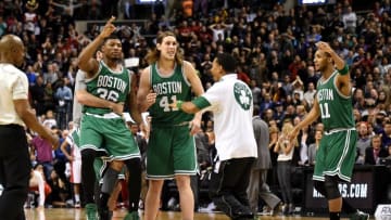 Apr 4, 2015; Toronto, Ontario, CAN; Boston Celtics guard Marcus Smart (36), forward Kelly Olynyk (41, guard Evan Turner (11) celebrate with team mates after beating Toronto Raptors 117-116 in overtime at Air Canada Centre. Mandatory Credit: Dan Hamilton-USA TODAY Sports