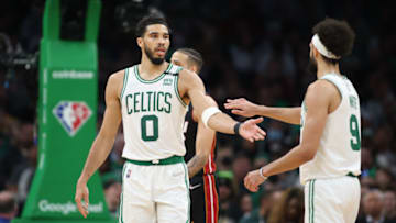 Boston Celtics forward Jayson Tatum (0) celebrates a play with guard Derrick White (9) Mandatory Credit: Paul Rutherford-USA TODAY Sports