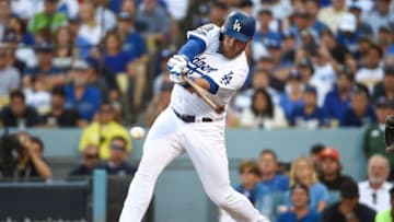 LOS ANGELES, CA - OCTOBER 17: Max Muncy #13 of the Los Angeles Dodgers hits a RBI single in the sixth inning against the Milwaukee Brewers in Game Five of the National League Championship Series at Dodger Stadium on October 17, 2018 in Los Angeles, California. (Photo by Kevork Djansezian/Getty Images)