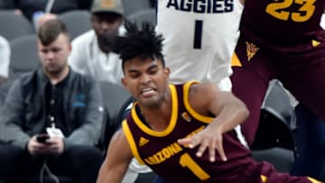 LAS VEGAS, NEVADA - NOVEMBER 21: Remy Martin #1 of the Arizona State Sun Devils reaches for a loose ball against the Utah State Aggies during the first half of the championship game of the MGM Resorts Main Event basketball tournament at T-Mobile Arena on November 21, 2018 in Las Vegas, Nevada. (Photo by David Becker/Getty Images)