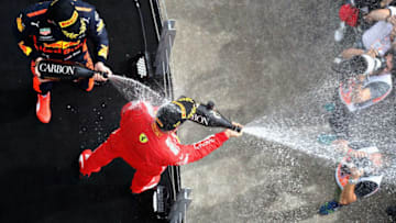 MONTREAL, QC - JUNE 10: Race winner Sebastian Vettel of Germany and Ferrari and third place finisher Max Verstappen of Netherlands and Red Bull Racing (Photo by Mark Thompson/Getty Images)