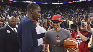 July 26, 2016; Oakland, CA, USA; USA guard Kevin Durant (5, left) shakes hands with Golden State Warriors guard Stephen Curry (right) after an exhibition basketball game at Oracle Arena. USA defeated China 107-57. Mandatory Credit: Kyle Terada-USA TODAY Sports