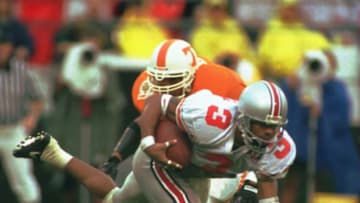 1 JAN 1996: DIMITRIOUS STANLEY OF OHIO STATE #3 IS TRIPPED UP BY JESSE SANDERS OF TENNESSEE #22 WHILE RETURNING A PUNT DURING THE FIRST HALF OF THE COMP USA FLORIDA CITRUS BOWL AT THE CITRUS BOWL IN ORLANDO. Mandatory Credit: Scott Halleran/ALLSPORT