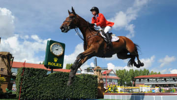 CALGARY, CANADA - SEPTEMBER 08: Beezie Madden of USA riding Simon competes in the individual jumping equestrian on the final day of the Masters tournament at Spruce Meadows on September 8, 2013 in Calgary, Alberta, Canada. Beezie placed 6th with a second round time of 71.27 seconds and 5 faults. (Photo by Derek Leung/Getty Images)