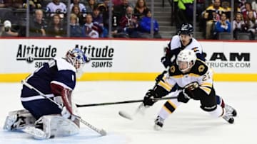 Nov 13, 2016; Denver, CO, USA; Boston Bruins center Austin Czarnik (27) attempts tp score on Colorado Avalanche goalie Semyon Varlamov (1) as defenseman Eric Gelinas (44) defends in the first period at Pepsi Center. Mandatory Credit: Ron Chenoy-USA TODAY Sports