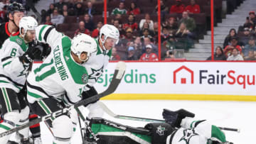 OTTAWA, CANADA - OCTOBER 24: Scott Wedgewood #41 of the Dallas Stars makes a second period save against the Ottawa Senators as his teammate Luke Glendening #11 looks on at Canadian Tire Centre on October 24, 2022 in Ottawa, Ontario, Canada. (Photo by Chris Tanouye/Freestyle Photo/Getty Images)