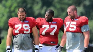 Jul 28, 2013; Flowery Branch, GA, USA; Atlanta Falcons guard Mike Johnson (79), offensive guard Theo Goins (77) and guard Garrett Reynolds (75) shown on the field during training camp at the Falcons Training Complex. Mandatory Credit: Dale Zanine-USA TODAY Sports