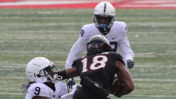 Joey Porter Jr. of Penn State tackles Bo Melton of Rutgers in the first half during a Big Ten college football match up that saw Penn State defeat Rutgers 23-7 in Piscataway, NJ on December 5, 2020.Big Ten College Football Penn State At Rutgers In Piscataway Nj On December 5 2020