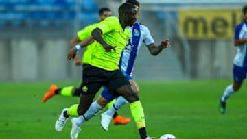 FARO, PORTUGAL - JULY 20: LOSC Lille forward Nicolas Pepe from Ivory Coast (L) tries to escape FC Porto defender Alex Telles from Brazil (R) during the match between FC Porto v LOSC Lille for Algarve Football Cup 2018 at Estadio do Algarve on July 20, 2018 in Faro, Portugal. (Photo by Carlos Rodrigues/Getty Images)
