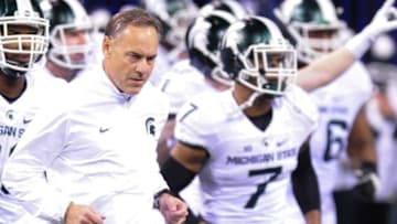 Dec 5, 2015; Indianapolis, IN, USA; Michigan State Spartans head coach Mark Dantonio leads his team onto the field for the game against the Iowa Hawkeyes in the Big Ten Conference football championship at Lucas Oil Stadium. Mandatory Credit: Thomas J. Russo-USA TODAY Sports