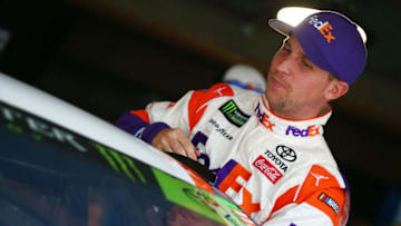 MARTINSVILLE, VA - OCTOBER 28: Denny Hamlin, driver of the #11 FedEx/Walgreens Toyota, climbs into his car during practice for the Monster Energy NASCAR Cup Series First Data 500 at Martinsville Speedway on October 28, 2017 in Martinsville, Virginia. (Photo by Sarah Crabill/Getty Images)