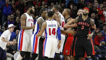 Dec 19, 2014; Auburn Hills, MI, USA; A scuffle breaks out on the court after Detroit Pistons center Andre Drummond (0) commits a flagrant foul on Toronto Raptors forward James Johnson (3) during the fourth quarter at The Palace of Auburn Hills. The Raptors won 110-100. Mandatory Credit: Raj Mehta-USA TODAY Sports