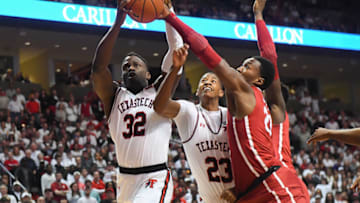 LUBBOCK, TX - FEBRUARY 13: Norense Odiase #32 and Jarrett Culver #23 of the Texas Tech Red Raiders battle Kameron McGusty #20 of the Oklahoma Sooners for the rebound during the game on February 13, 2018 at United Supermarket Arena in Lubbock, Texas. Texas Tech defeated Oklahoma 88-78. (Photo by John Weast/Getty Images)