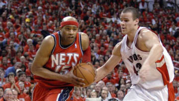 TORONTO - APRIL 21: Vince Carter #15 of the New Jersey Nets gets around Kris Humphries #43 of the Toronto Raptors in Game One of the Eastern Conference Quarterfinals during the 2007 NBA Playoffs at Air Canada Centre on April 21, 2007 in Toronto, Ontario, Canada. Nets won 96-91. NOTE TO USER: User expressly acknowledges and agrees that, by downloading and or using this photograph, User is consenting to the terms and conditions of the Getty Images License Agreement. (Photo by Dave Abel/Getty Images)
