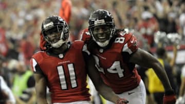 Jan 20, 2013; Atlanta, GA, USA; Atlanta Falcons wide receiver Julio Jones (11) celebrates a touchdown catch against the San Francisco 49ers with wide receiver Roddy White (84) during the second quarter of the NFC Championship game at the Georgia Dome. Mandatory Credit: Dale Zanine-USA TODAY Sports