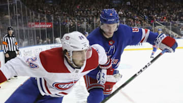 NEW YORK, NEW YORK - DECEMBER 06: Phillip Danault #24 of the Montreal Canadiens skates against Jacob Trouba #8 of the New York Rangers at Madison Square Garden on December 06, 2019 in New York City. The Canadiens defeated the Rangers 2-1. (Photo by Bruce Bennett/Getty Images)