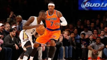 Dec 1, 2013; New York, NY, USA; New York Knicks small forward Carmelo Anthony (7) defends New Orleans Pelicans shooting guard Anthony Morrow (3) during the first quarter at Madison Square Garden. Mandatory Credit: Anthony Gruppuso-USA TODAY Sports
