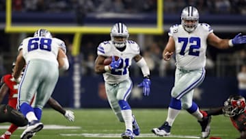 Dec 18, 2016; Arlington, TX, USA; Dallas Cowboys running back Ezekiel Elliott (21) runs the ball in the first quarter against the Tampa Bay Buccaneers at AT&T Stadium. Mandatory Credit: Tim Heitman-USA TODAY Sports
