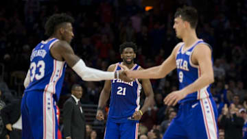 PHILADELPHIA, PA - JANUARY 15: Joel Embiid #21, Robert Covington #33, and Dario Saric #9 of the Philadelphia 76ers celebrate in the fourth quarter against the Toronto Raptors at the Wells Fargo Center on January 15, 2018 in Philadelphia, Pennsylvania. The 76ers defeated the Raptors 117-111. NOTE TO USER: User expressly acknowledges and agrees that, by downloading and or using this photograph, User is consenting to the terms and conditions of the Getty Images License Agreement. (Photo by Mitchell Leff/Getty Images)