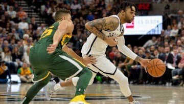 SALT LAKE CITY, UT - MARCH 16: D'Angelo Russell #1 of the Brooklyn Nets drives past Raul Neto #25 of the Utah Jazz during a game at Vivint Smart Home Arena on March 16, 2019 in Salt Lake City, Utah. NOTE TO USER: User expressly acknowledges and agrees that, by downloading and or using this photograph, User is consenting to the terms and conditions of the Getty Images License Agreement. (Photo by Alex Goodlett/Getty Images)
