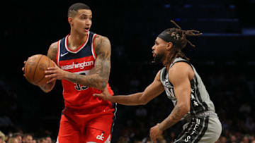 Oct 25, 2021; Brooklyn, New York, USA; Washington Wizards forward Kyle Kuzma (33) controls the ball against Brooklyn Nets guard Patty Mills (8) during the first quarter at Barclays Center. Mandatory Credit: Brad Penner-USA TODAY Sports