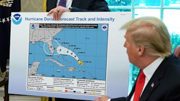WASHINGTON, DC - SEPTEMBER 04: U.S. President Donald Trump (R) references a map held by acting Homeland Security Secretary Kevin McAleenan while talking to reporters following a briefing from officials about Hurricane Dorian in the Oval Office at the White House September 04, 2019 in Washington, DC. The map was a forecast from August 29 and appears to have been altered by a black marker to extend the hurricane's range to include Alabama. (Photo by Chip Somodevilla/Getty Images)