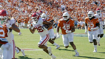 Oklahoma's Kennedy Brooks (26) runs for the game-winning touchdown the Red River Showdown college football game between the University of Oklahoma Sooners (OU) and the University of Texas (UT) Longhorns at the Cotton Bowl in Dallas, Saturday, Oct. 9, 2021. Oklahoma won 55-48.Ou Vs Texas