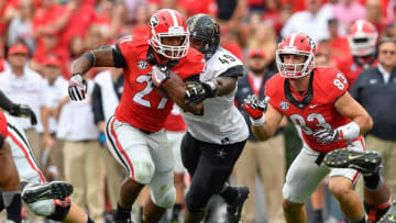 Oct 15, 2016; Athens, GA, USA; Georgia Bulldogs running back Nick Chubb (27) runs against Vanderbilt Commodores defensive end Jonathan Wynn (49) during the second half at Sanford Stadium. Vanderbilt defeated Georgia 17-16. Mandatory Credit: Dale Zanine-USA TODAY Sports