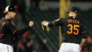 Apr 8, 2016; Baltimore, MD, USA; Baltimore Orioles pitcher Brad Brach (35) celebrate with catcher Matt Wieters (32) after beating the Tampa Bay Rays 6-1 at Oriole Park at Camden Yards. Mandatory Credit: Evan Habeeb-USA TODAY Sports