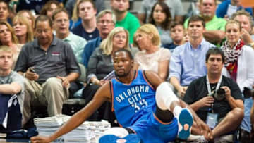 Oct 10, 2014; Dallas, TX, USA; Oklahoma City Thunder forward Kevin Durant (35) is knocked to the floor during the first half against the Dallas Mavericks at the American Airlines Center. Mandatory Credit: Jerome Miron-USA TODAY Sports