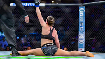 Jan 22, 2022; Anaheim, California, USA; Vanessa Demopoulos (blue gloves) reacts to her win by submission over Silvana Gomez Juarez (red gloves) during UFC 270 at Honda Center. Mandatory Credit: Gary A. Vasquez-USA TODAY Sports