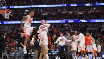 Mar 25, 2016; Chicago, IL, USA; Syracuse Orange forward Michael Gbinije (0) celebrates with teammates after defeating the Gonzaga Bulldogs in a semifinal game in the Midwest regional of the NCAA Tournament at United Center. Mandatory Credit: Dennis Wierzbicki-USA TODAY Sports