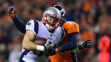 DENVER, CO - NOVEMBER 12: Running back Rex Burkhead #34 of the New England Patriots runs for a touchdown after a catch in the first quarter of a game as free safety Darian Stewart #26 of the Denver Broncos pursues at Sports Authority Field at Mile High on November 12, 2017 in Denver, Colorado. (Photo by Dustin Bradford/Getty Images)