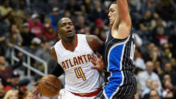 Feb 8, 2016; Atlanta, GA, USA; Atlanta Hawks forward Paul Millsap (4) attempts to dribbles the ball around Orlando Magic forward Aaron Gordon (00) during the second half at Philips Arena. The Magic won 117-110 in overtime. Mandatory Credit: Dale Zanine-USA TODAY Sports