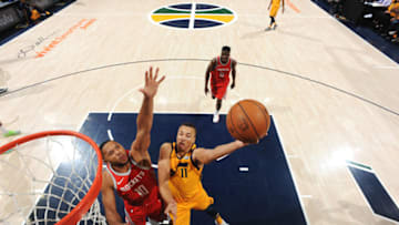SALT LAKE CITY, UT - MAY 6: Dante Exum #11 of the Utah Jazz shoots the ball over Eric Gordon #10 of the Houston Rockets during Game Four of the Western Conference Semifinals of the 2018 NBA Playoffs on May 6, 2018 at the Vivint Smart Home Arena Salt Lake City, Utah. NOTE TO USER: User expressly acknowledges and agrees that, by downloading and or using this photograph, User is consenting to the terms and conditions of the Getty Images License Agreement. Mandatory Copyright Notice: Copyright 2018 NBAE (Photo by Andrew D. Bernstein/NBAE via Getty Images)