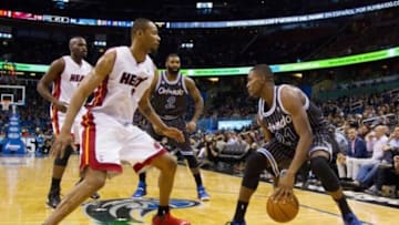 Jan 4, 2014; Orlando, FL, USA; Miami Heat power forward Rashard Lewis (9) defends Orlando Magic small forward Maurice Harkless (21) during the second half of the game at the Amway Center. Mandatory Credit: Rob Foldy-USA TODAY Sports
