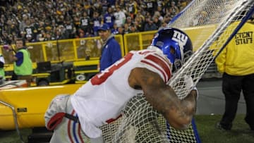 Oct 9, 2016; Green Bay, WI, USA; New York Giants wide receiver Odell Beckham Jr. (13) reacts after his touchdown catch was upheld in the fourth quarter during the game against the Green Bay Packers at Lambeau Field. Mandatory Credit: Benny Sieu-USA TODAY Sports