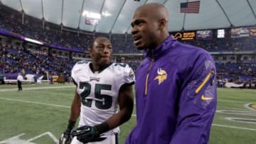 Minnesota Vikings running back Adrian Peterson (28) talks with Philadelphia Eagles running back LeSean McCoy (25) following the game at Mall of America Field at H.H.H. Metrodome. The Vikings defeated the Eagles 48-30. Mandatory Credit: Brace Hemmelgarn-USA TODAY Sports