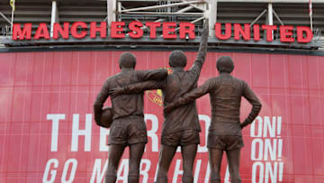 MANCHESTER, ENGLAND - MARCH 26: A statue showing George Best, Denis Law and Bobby Charlton is seen outside Old Trafford, the home of Manchester United FC, on March 26, 2021 in Manchester, England. (Photo by James Gill - Danehouse/Getty Images)