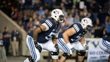 PROVO, UT - SEPTEMBER 11: Offensive Linemen De'Ondre Wesley #57 and Brock Stringham #74 of the BYU Cougars line up during a game against the Houston Cougars on September 11, 2014 at LaVell Edwards Stadium in Provo, Utah. (Photo by Jay Drowns/Getty Images)