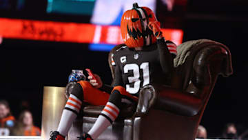 CLEVELAND, OHIO - APRIL 29: A Cleveland Browns fan sits onstage during round one of the 2021 NFL Draft at the Great Lakes Science Center on April 29, 2021 in Cleveland, Ohio. (Photo by Gregory Shamus/Getty Images)