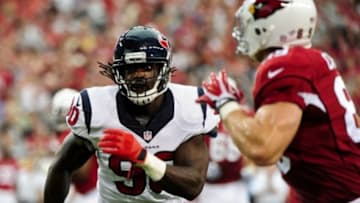 Aug 9, 2014; Glendale, AZ, USA; Houston Texans linebacker Jadeveon Clowney (90) covers Arizona Cardinals tight end John Carlson (89) during the first half at University of Phoenix Stadium. Mandatory Credit: Matt Kartozian-USA TODAY Sports