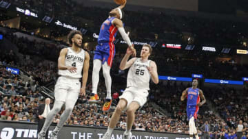 SAN ANTONIO, TX - DECEMBER 28: Bruce Brown #6 of the Detroit Pistons dunks past Derrick White #4 of the San Antonio Spurs during second half action at AT&T Center on December 28, 2019 in San Antonio, Texas. San Antonio Spurs defeated the Detroit Pistons 136-109. NOTE TO USER: User expressly acknowledges and agrees that , by downloading and or using this photograph, User is consenting to the terms and conditions of the Getty Images License Agreement. (Photo by Ronald Cortes/Getty Images)