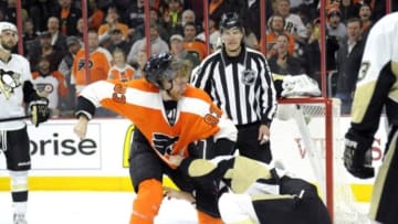 Jan 20, 2015; Philadelphia, PA, USA; Philadelphia Flyers right wing Jakub Voracek (93) fight against Pittsburgh Penguins defenseman Rob Scuderi (4) during the second period at Wells Fargo Center. Mandatory Credit: Eric Hartline-USA TODAY Sports