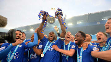 LEICESTER, ENGLAND - MAY 07: Captain Wes Morgan of Leicester City lifts the Premier League Trophy as players celebrate the season champions after the Barclays Premier League match between Leicester City and Everton at The King Power Stadium on May 7, 2016 in Leicester, United Kingdom. (Photo by Michael Regan/Getty Images)