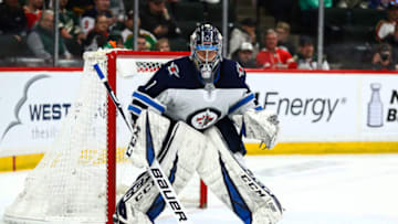 Apr 2, 2019; Saint Paul, MN, USA; Winnipeg Jets goaltender Eric Comrie (1) looks for the puck in the third period against the Minnesota Wild at Xcel Energy Center. Mandatory Credit: David Berding-USA TODAY Sports