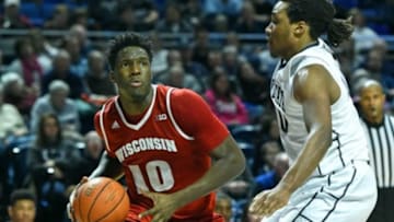 Jan 21, 2016; University Park, PA, USA; Wisconsin Badgers forward Nigel Hayes (10) drives to the basket past Penn State Nittany Lions forward Brandon Taylor (10) during the second half at the Bryce Jordan Center. Wisconsin won 66-60. Mandatory Credit: Rich Barnes-USA TODAY Sports