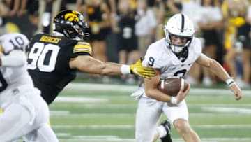 IOWA CITY, IOWA- SEPTEMBER 23: Quarterback Trace McSorley #9 of the Penn State Nittany Lions runs on a keeper during the third quarter past defensive end Sam Brincks #90 of the Iowa Hawkeyes on September 23, 2017 at Kinnick Stadium in Iowa City, Iowa. (Photo by Matthew Holst/Getty Images)