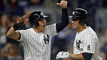 Sep 27, 2016; Bronx, NY, USA; New York Yankees catcher Gary Sanchez (24) celebrates hitting a two-run home run with New York Yankees center fielder Jacoby Ellsbury (22) during the first inning against the Boston Red Sox at Yankee Stadium. Mandatory Credit: Adam Hunger-USA TODAY Sports