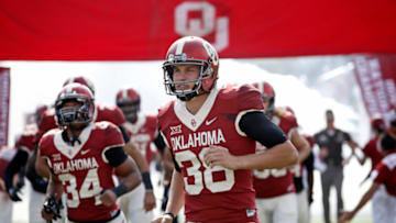 NORMAN, OK - OCTOBER 3: Punter Jack Steed #38 of the Oklahoma Sooners takes the field before the game against the West Virginia Mountaineers October 3, 2015 at Gaylord Family-Oklahoma Memorial Stadium in Norman, Oklahoma. Oklahoma defeated West Virginia 44-24.(Photo by Brett Deering/Getty Images)